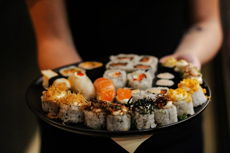 Selective Focus of Sushis on Black Plate