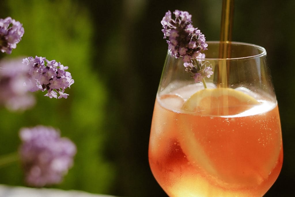 A vibrant summer drink with lemon and lavender, perfect for warm days.