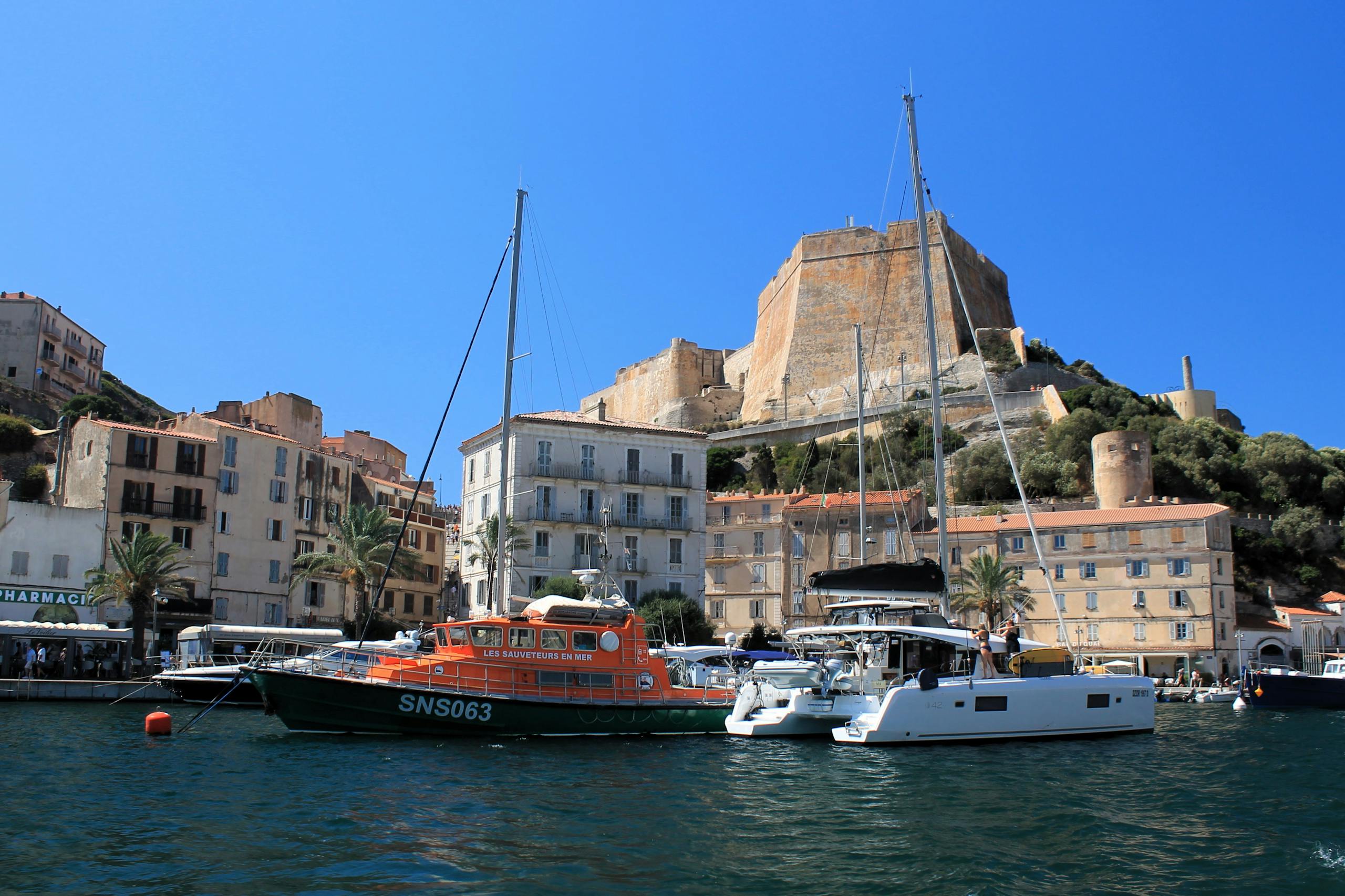 Picturesque Bonifacio citadel and harbor with yachts in Corsica, France.
